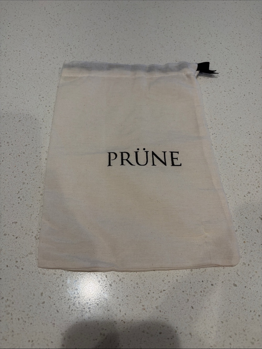 PRÜNE Drawstring Dust Bag in Cream with Black Logo